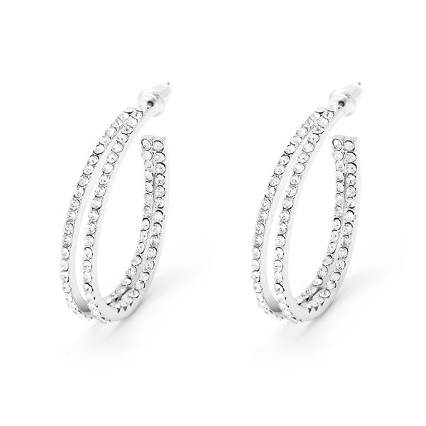 Silver tone double hoop earrings with clear crystals