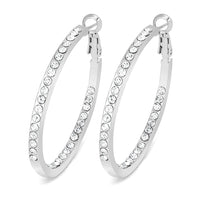 Medium silver tone hoop earrings with row of crystals inside and out